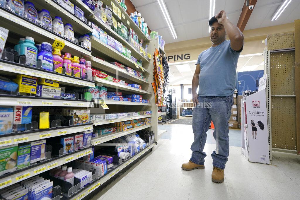 Ted S. Warren Ricky Maan looks at shelves displaying first-aid items, Monday, Sept. 27, 2021, in the grocery store his family owns in Chester, Mont., near the scene where an Amtrak train derailed Saturday, killing three people and injuring others. When the crash happened, Maan and others in his family rushed to the scene with first-aid and food supplies taken right from the shelves of their store. (AP Photo/Ted S. Warren)