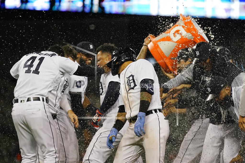 Carlos Osorio Detroit Tigers designated hitter Miguel Cabrera, center, is doused after scoring the winning run during the ninth inning of a baseball game against the Cleveland Guardians, Thursday, May 26, 2022, in Detroit. (AP Photo/Carlos Osorio)