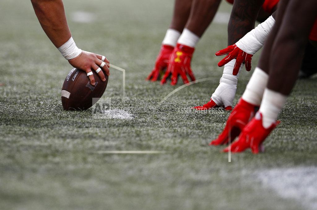 Patrick Semansky FILE - In this Saturday, Oct. 13, 2018, file photo, a Rutgers player, left, prepares to snap the ball during the second half of an NCAA college football game against Maryland in College Park, Md. The best offensive lines are greater than the sum of their parts. Former Notre Dame star offensive lineman Aaron Taylor, now an analyst for CBS Sports, is one of the driving forces behind the Joe Moore Award, which honors the best offensive line in the college football. (AP Photo/Patrick Semansky, File)