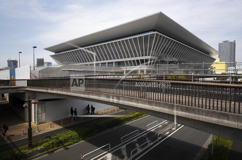 Hiro Komae Tokyo Aquatics Centre, where swim trials were being held for Japan's Olympic team, in Tokyo Thursday, April 8, 2021. The aquatics center is also a planned venue for the Tokyo 2020 Olympic and Paralympic Games, rescheduled to start in July 2021. Many preparations are still up in the air as organizers try to figure out how to hold the postponed games in the middle of a pandemic. (AP Photo/Hiro Komae)