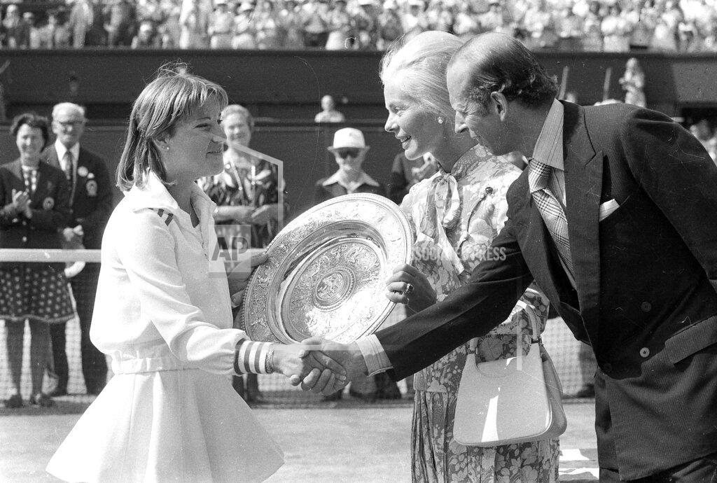 Bob Dear FILE - In this July 2, 1976, file photo, Chris Evert Lloyd shakes hands with the Duke of Kent, While the Duchess of Kent presents her with the winner's trophy after she beat Australia's Evonne Goolagong Cawley in the final of the women's singles championship at Wimbledon. (AP Photo/Bob Dear, File)