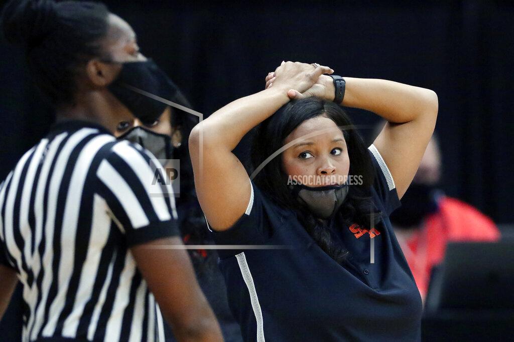 Michael Wyke Sam Houston State head coach Ravon Justice looks at an official after a foul call during the first half of an NCAA college basketball game against Stephen F. Austin for the Southland Conference women's tournament championship Sunday, March 14, 2021, in Katy, Texas. (AP Photo/Michael Wyke)