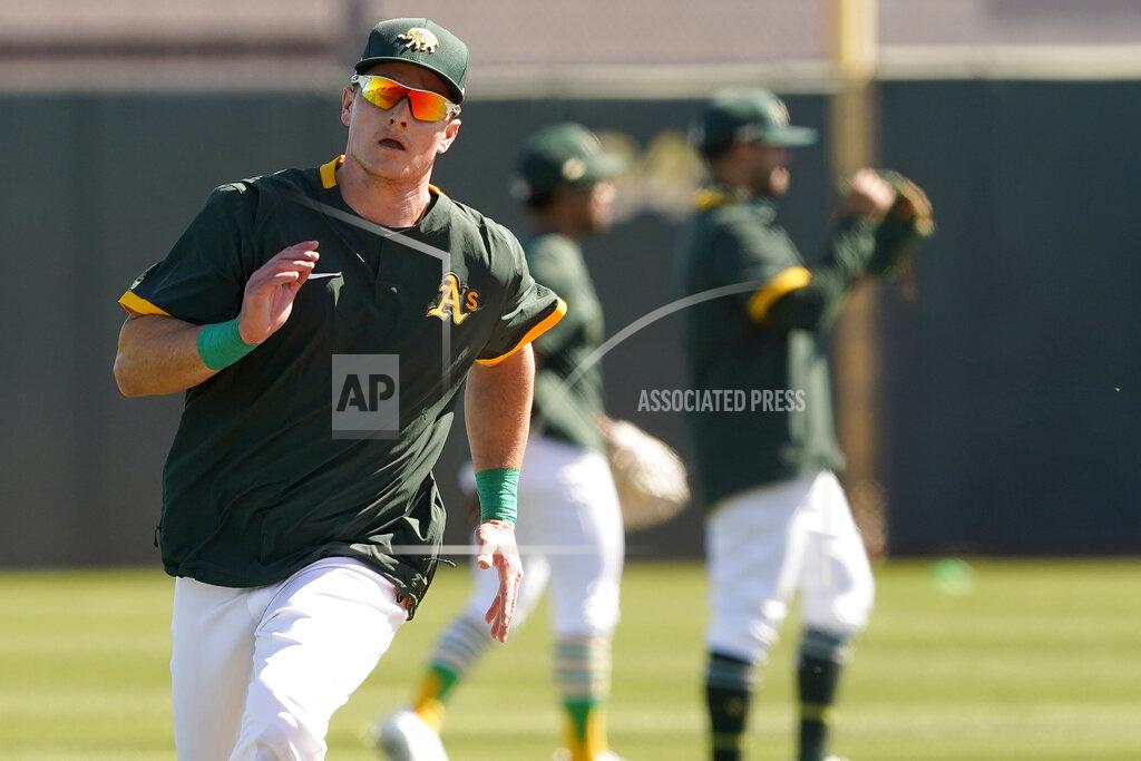Matt York Oakland Athletics' Matt Chapman runs during a spring training baseball practice, Monday, Feb. 22, 2021, in Mesa, Ariz. (AP Photo/Matt York)