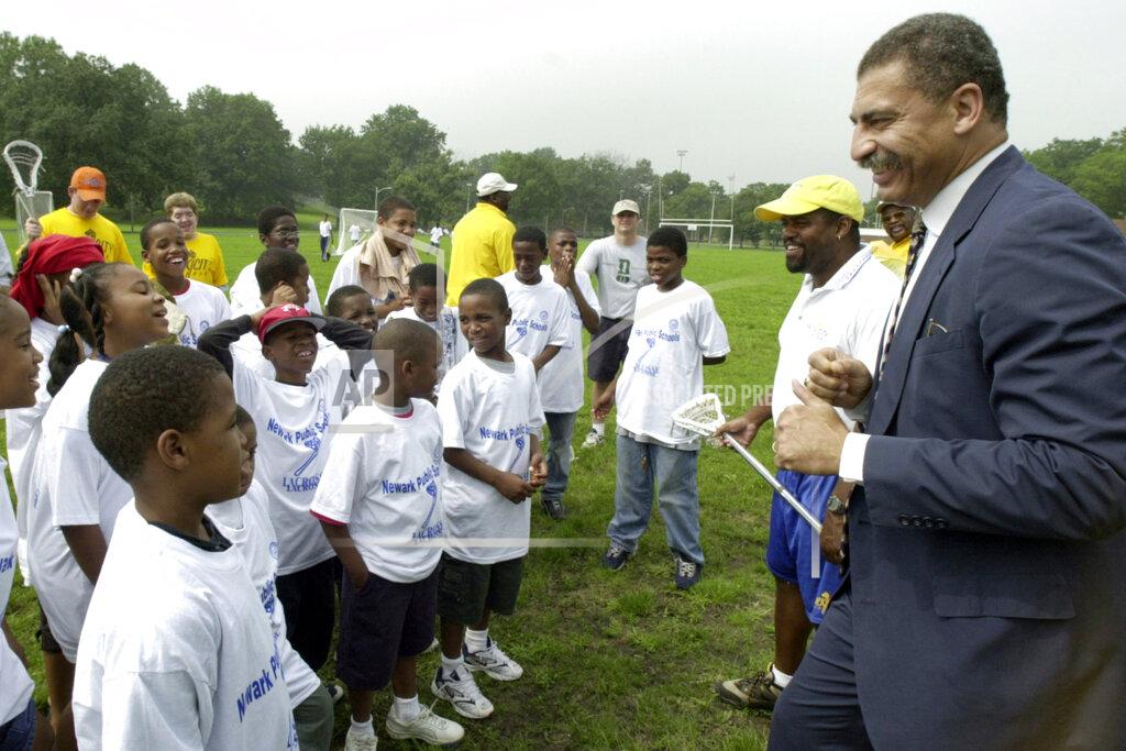 William Perlman FILE - Elnardo Webster, Director of Summer Youth Development Program, gives a pep talk to the kids before a lacrosse clinic of the school district's new Summer Youth Development Program Activities at West Side Park on Aug. 1, 2000, in Newark, N.J. Webster, who put Saint Peter's basketball on the map more than a half century ago in leading the Peacocks to the NIT semifinals in 1968, died on Tuesday, March 21, 2022, in Morristown, N.J., after being hospitalized with a heart issue, former teammates said. He was 74. (William Perlman/NJ Advance Media via AP, File)