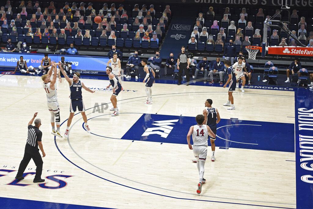 Jose Carlos Fajardo Saint Mary's Matthias Tass (11) attempts a 3-point basket over Gonzaga's Drew Timme (2) during the first half of an NCAA college basketball game in Moraga, Calif., Saturday, Jan. 16, 2021. (Jose Carlos Fajardo/Bay Area News Group via AP)