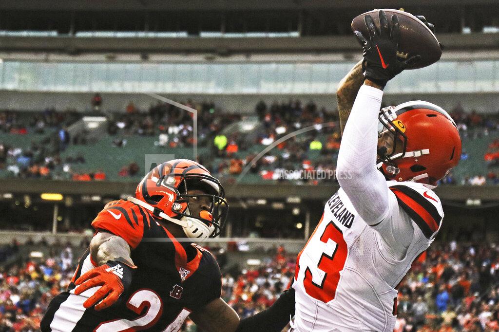 Gary Landers Cleveland Browns wide receiver Odell Beckham Jr., right, catches a 20-yard touchdown pass under pressure from Cincinnati Bengals cornerback Darius Phillips, left, during the second half of an NFL football game, Sunday, Dec. 29, 2019, in Cincinnati. (AP Photo/Gary Landers)