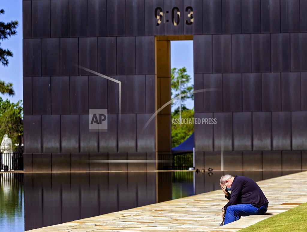 Chris Landsberger Visitor Mark Dodge takes a moment alone to pay his respects to the lives lost in the Oklahoma City bombing during the 26th Anniversary Remembrance Ceremony at the Oklahoma City National Memorial and Museum in Oklahoma City, Okla on Monday, April 19, 2021. (Chris Landsberger/The Oklahoman via AP)