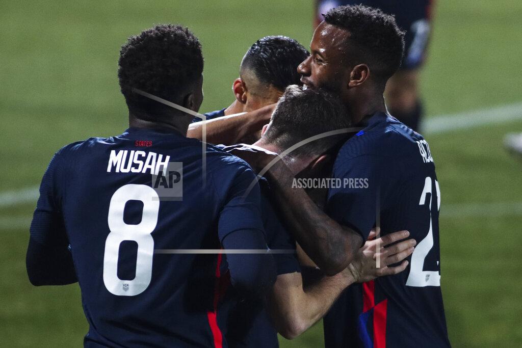 Ronald Zak US players celebrate after scoring the opening goal during the international friendly soccer match between USA and Jamaica at SC Wiener Neustadt stadium in Wiener Neustadt, Austria, Thursday, March 25, 2021. (AP Photo/Ronald Zak)