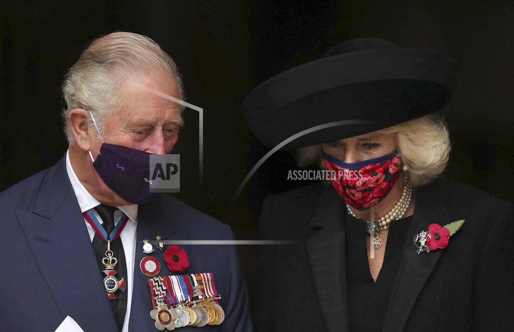 Aaron Chown Britain's Prince Charles and Camilla Duchess of Cornwall leave after attending the Armistice Day service at Westminster Abbey in London, Wednesday, Nov. 11, 2020. The specially arranged service, with social distancing because of the coronavirus, commemorates the 102nd anniversary of the armistice ending World War I, and one hundred years since the symbolic interment of the Unknown Warrior at Westminster Abbey. (Aaron Chown/Pool via AP)