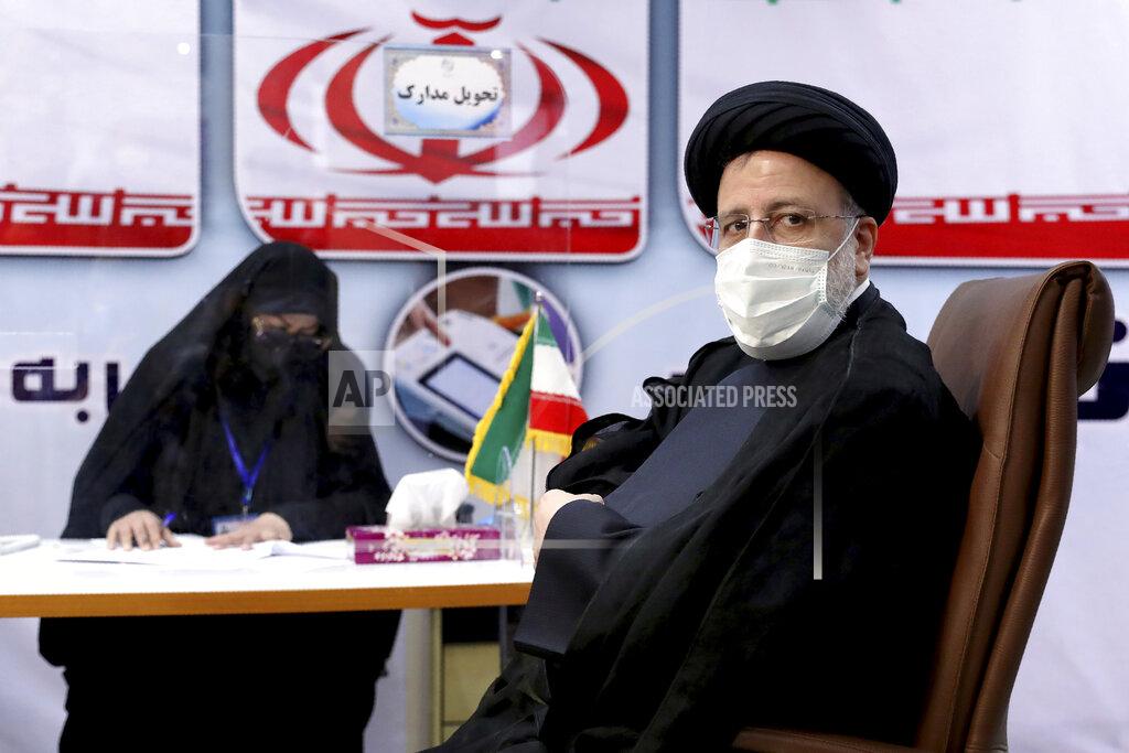Ebrahim Noroozi Ebrahim Raisi, head of Iran's judiciary registers his name as a candidate for the June 18 presidential elections at the interior Ministry in Tehran, Iran, Saturday, May 15, 2021. (AP Photo/Ebrahim Noroozi)
