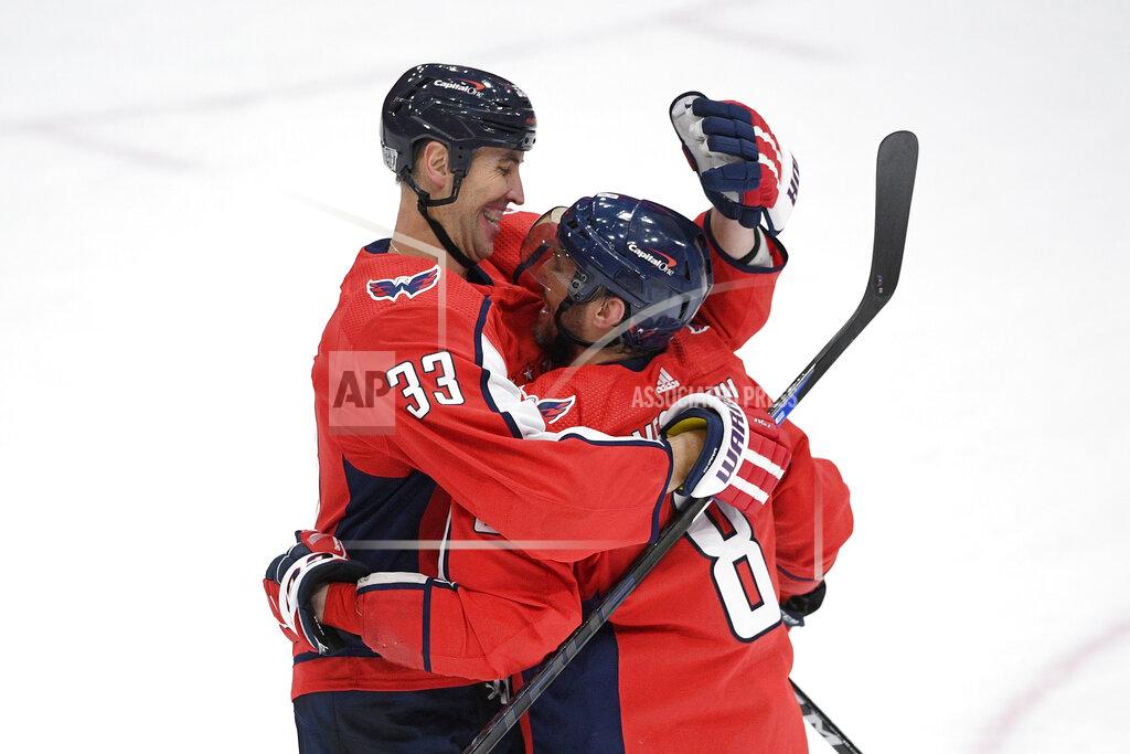 Nick Wass Washington Capitals defenseman Zdeno Chara (33) and left wing Alex Ovechkin (8) celebrate after an NHL hockey game against the Boston Bruins, Saturday, Jan. 30, 2021, in Washington. The Capitals won 4-3 in overtime. (AP Photo/Nick Wass)