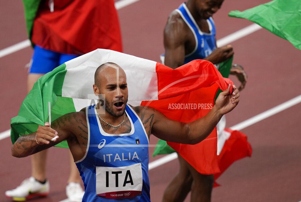 Francisco Seco Lamont Jacobs of Italy celebrates after taking the gold medal in the final of the men's 4 x 100-meter relay at the 2020 Summer Olympics, Friday, Aug. 6, 2021, in Tokyo, Japan. (AP Photo/Francisco Seco)