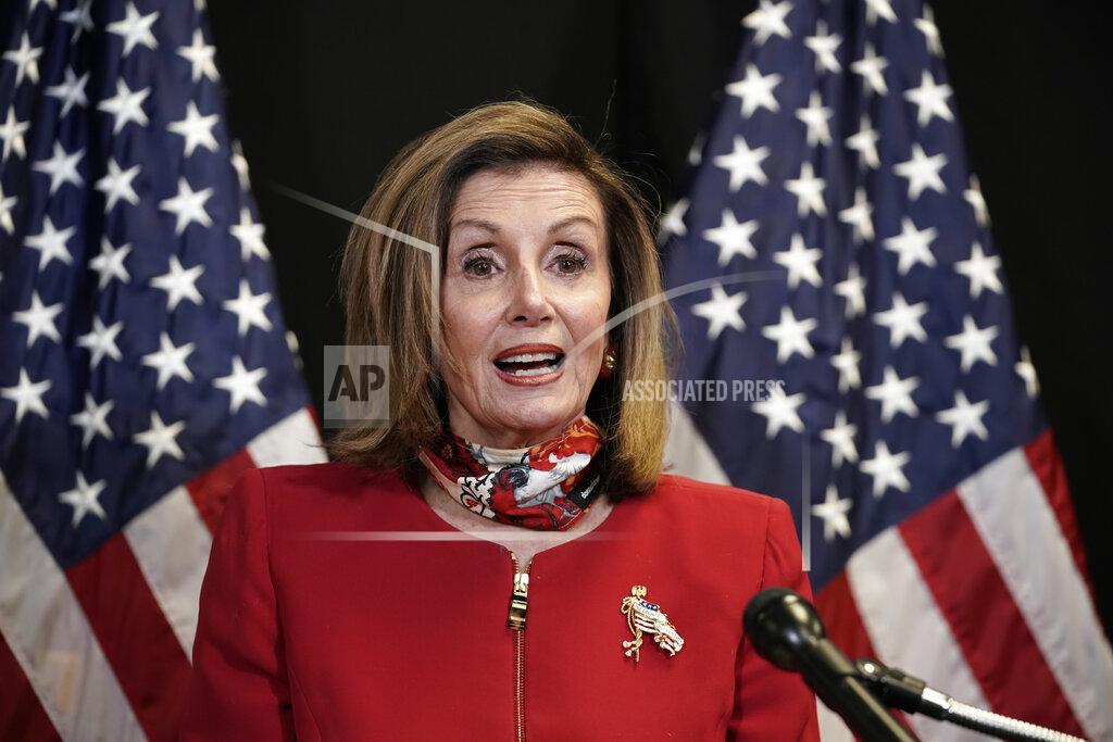 J. Scott Applewhite Speaker of the House Nancy Pelosi, D-Calif., talks to reporters about Election Day results in races for the House of Representatives, at Democratic National Committee headquarters in Washington, Tuesday, Nov. 3, 2020. She was joined on a video call by Rep. Cheri Bustos, D-Ill., chairwoman of the Democratic Congressional Campaign Committee. (AP Photo/J. Scott Applewhite, Pool)