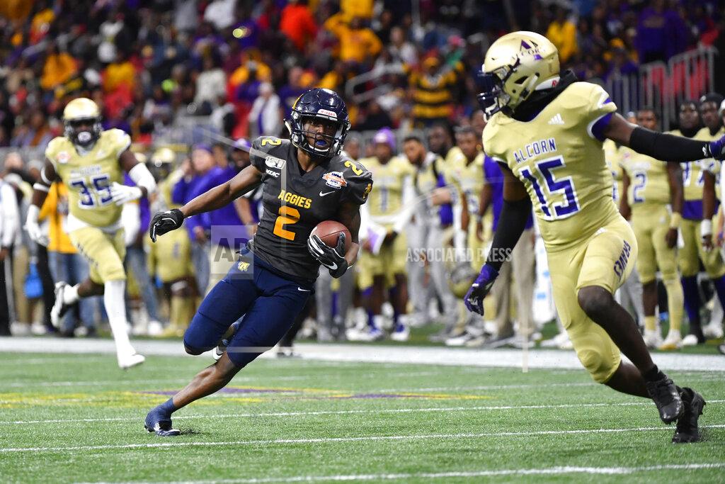 John Amis North Carolina A&T wide receiver Korey Banks (2) cuts back on Alcorn State defensive back Keyron Kinsler Jr. (15) during a long run in the second half of the Celebration Bowl NCAA college football game, Saturday, Dec. 21, 2019, in Atlanta. North Carolina A&T won 64-44. (John Amis/Atlanta Journal-Constitution via AP)