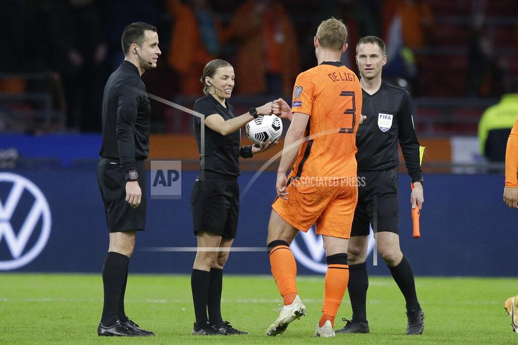 Peter Dejong Referee Stephanie Frappart cheers with Netherlands' Matthijs de Ligt at the end of the World Cup 2022 group G qualifying soccer match between The Netherlands and Latvia at the Johan Cruyff ArenA in Amsterdam, Netherlands, Saturday, March 27, 2021. (AP Photo/Peter Dejong)