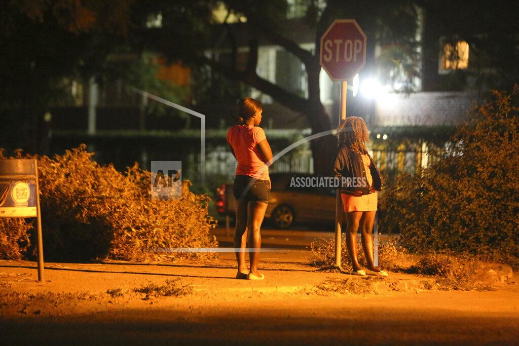 Tsvangirayi Mukwazhi Sex workers wait for clients in the red light district of Harare, Zimbabwe, Friday, June, 5, 2020. As the coronavirus spreads in Africa, it increasingly threatens those who earn their living on the streets, including sex workers with HIV. (AP Photo/Tsvangirayi Mukwazhi)