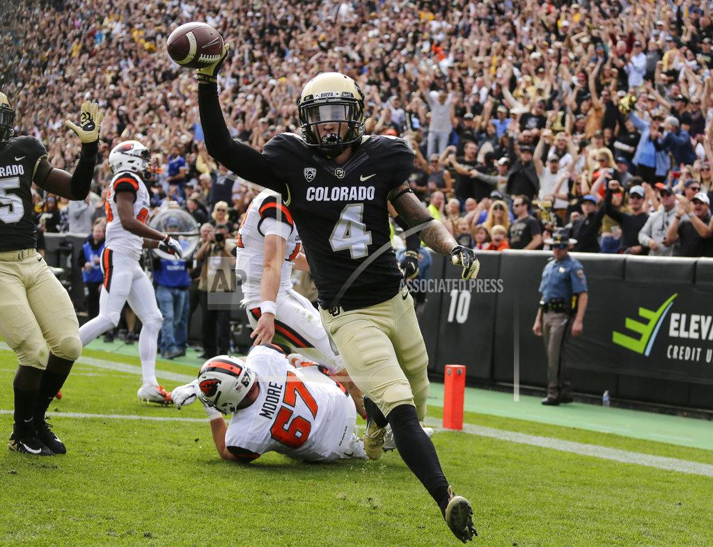 Jack Dempsey Colorado defensive back Dante Wigley (4) scores a touchdown after intercepting a pass against Oregon State during the first half of an NCAA college football game, Saturday, Oct. 27, 2018, in Boulder, Colo. (AP Photo/Jack Dempsey)