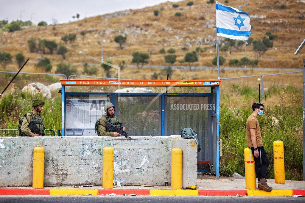 Oded Balilty Israeli soldiers guard a bus station at the Tapuach junction next to the West Bank city of Nablus, Tuesday, June 30, 2020. Israeli Prime Minister Benjamin Netanyahu appears determined to carry out his pledge to begin annexing parts of the occupied West Bank, possibly as soon as Wednesday. (AP Photo/Oded Balilty)