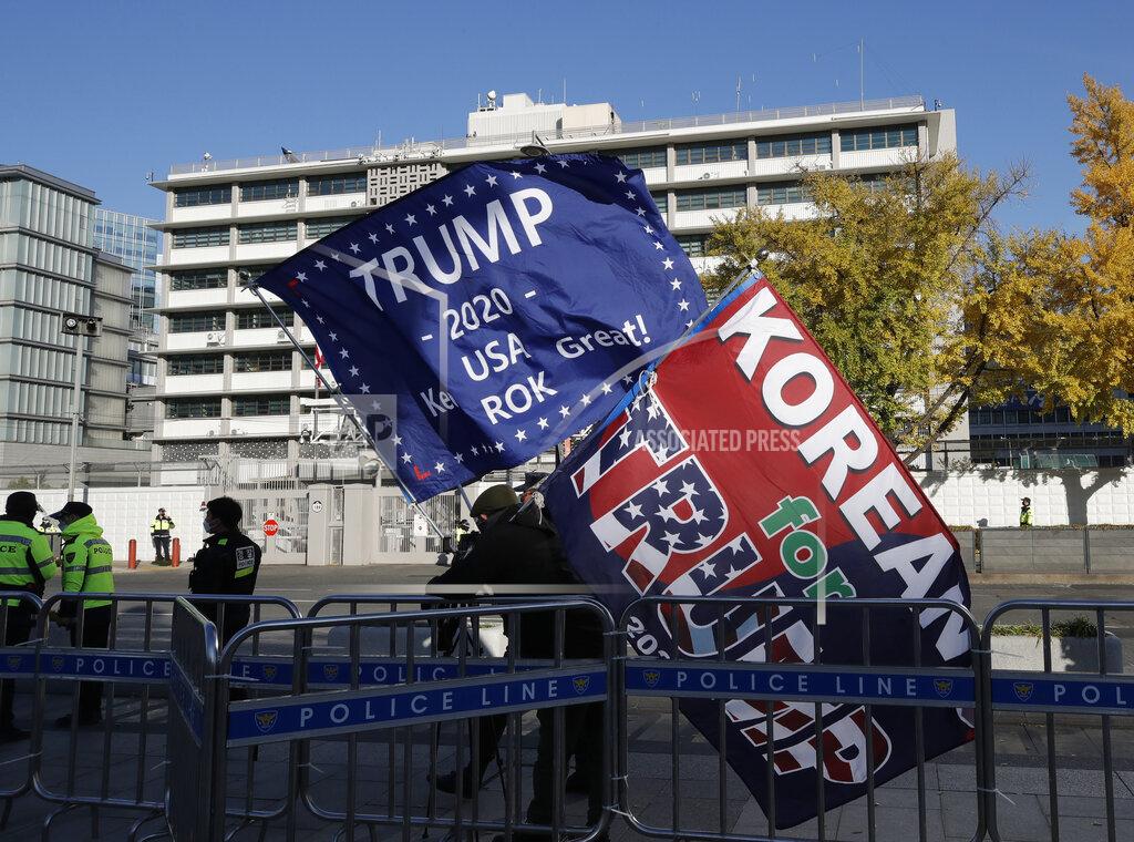 Lee Jin-Man South Korean supporters of U.S. President Donald Trump hold flags near the U.S. Embassy in Seoul, South Korea, Wednesday, Nov. 4, 2020. (AP Photo/Lee Jin-man)