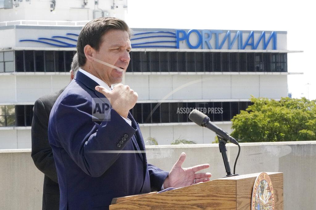 Wilfredo Lee Florida Gov. Ron DeSantis speaks during a news conference, Thursday, April 8, 2021, at PortMiami in Miami. DeSantis announced a lawsuit against the federal government and the CDC demanding that cruise ships be allowed to sail. (AP Photo/Wilfredo Lee)