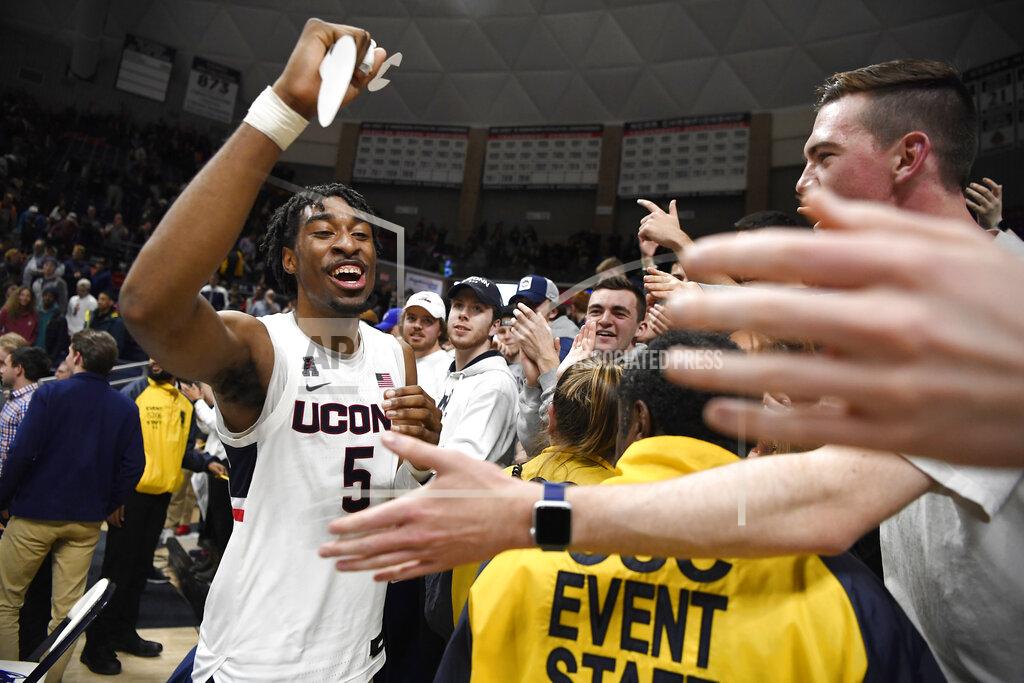 Jessica Hill Connecticut's Isaiah Whaley celebrates with fans at the end an NCAA college basketball game against Houston, Thursday, March 5, 2020, in Storrs, Conn. (AP Photo/Jessica Hill)