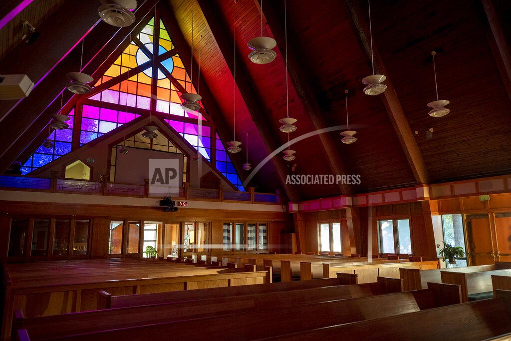 Grace Beahm Alford This interior of the chapel at Joint Base Charleston is shown Oct. 13, 2021, in North Charleston, S.C. Attendance is dwindling at the Protestant worship services in the chapel. (Grace Beahm Alford/The Post And Courier via AP)