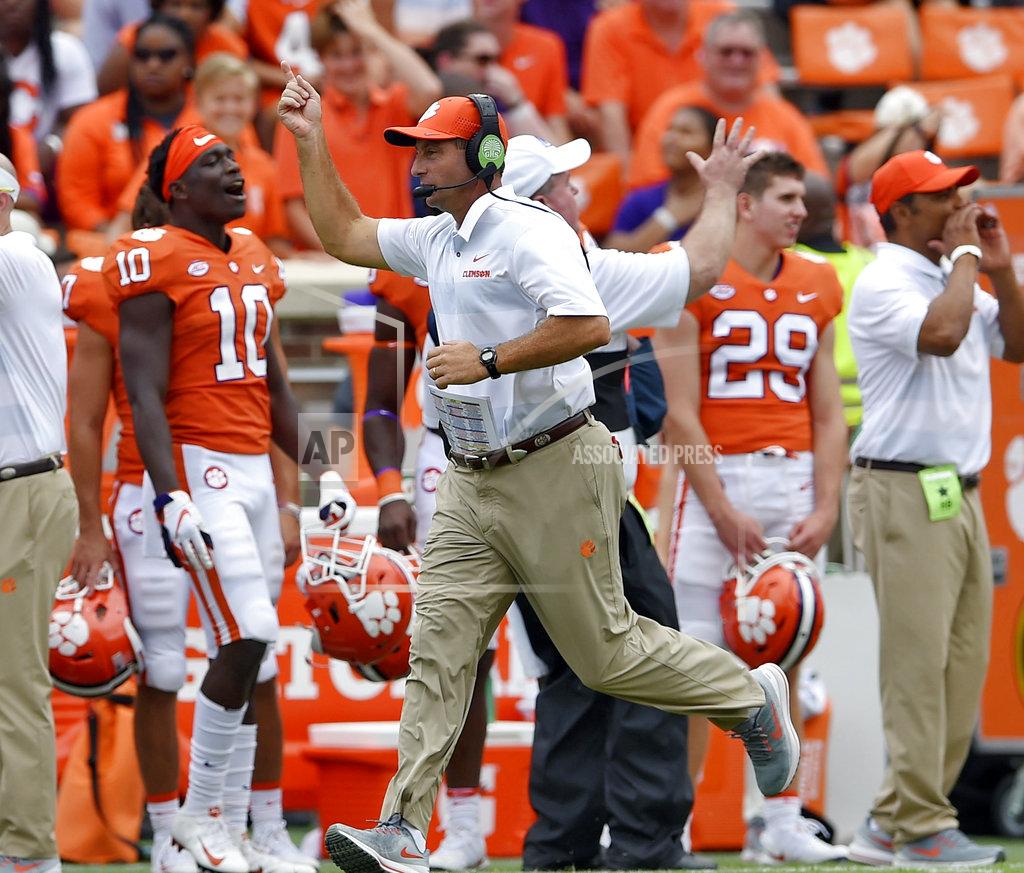 Richard Shiro FILE - In this Sept. 15, 2018, file photo, Clemson head coach Dabo Swinney works the sideline during the second half of an NCAA college football game against Georgia Southern, in Clemson, S.C. Coach Dino Babers has led Syracuse to a surprising 4-2 record midway through the season, while Clemson and North Carolina State, led by quarterback Ryan Finley, are undefeated entering a big showdown this week. All drew attention in midseason voting by AP writers covering the 14 ACC teams. (AP Photo/Richard Shiro, File)