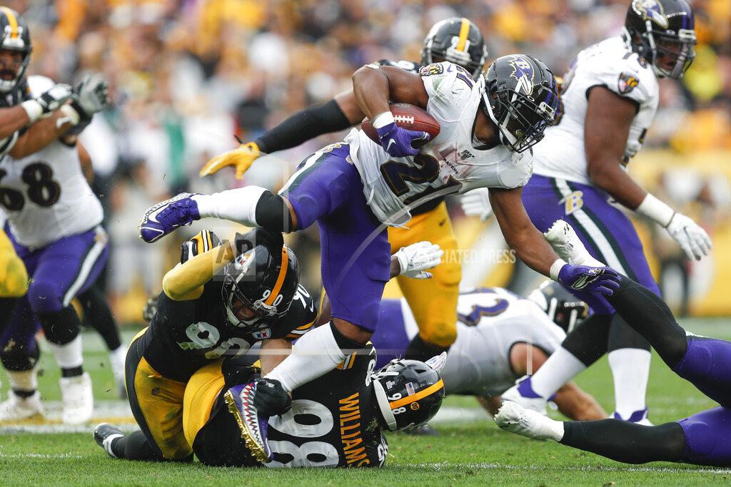 Don Wright Baltimore Ravens running back Mark Ingram (21) leaps over Pittsburgh Steelers outside linebacker T.J. Watt (90) on a run in the second half of an NFL football game, Sunday, Oct. 6, 2019, in Pittsburgh. (AP Photo/Don Wright)