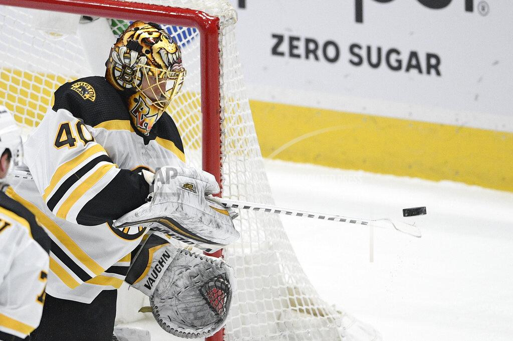 Nick Wass Boston Bruins goaltender Tuukka Rask (40) reaches for the puck during the second period of an NHL hockey game against the Washington Capitals, Saturday, Jan. 30, 2021, in Washington. (AP Photo/Nick Wass)