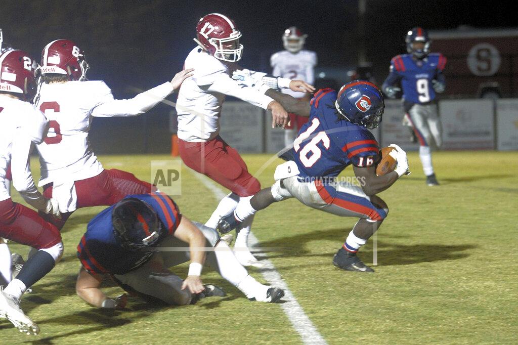 Mike Pettus In this photo provided by Mike Pettus, Central of Clay County High School's Quentin Knight (16) scores against Sardis High School during a football game in Lineville, Ala., Friday, Nov. 8, 2019. At Central of Clay County High School in Alabama, small-town football is thriving. The team has helped bond two communities that were once fierce rivals, then reluctant partners, and now proud supporters of a two-time Class 5A state football champions. (Mike Pettus via AP)