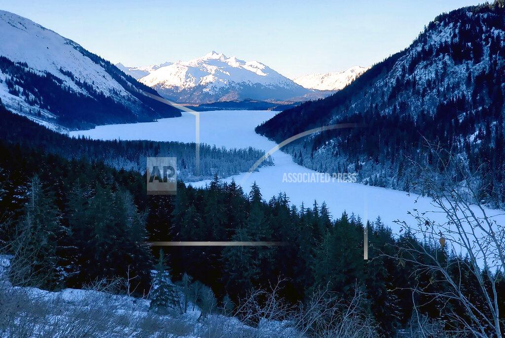 Erik Stevens This Feb. 13, 2021 photo provided by Erik Stevens shows a remote area of Alaska where Shannon Stevens, her brother Erik Stevens and his girlfriend took snowmobiles into into the wilderness northwest of Haines, Alaska. Shannon Stevens was using an outhouse in the backcountry and she was attacked by a bear, from below.(Erik Stevens via AP)