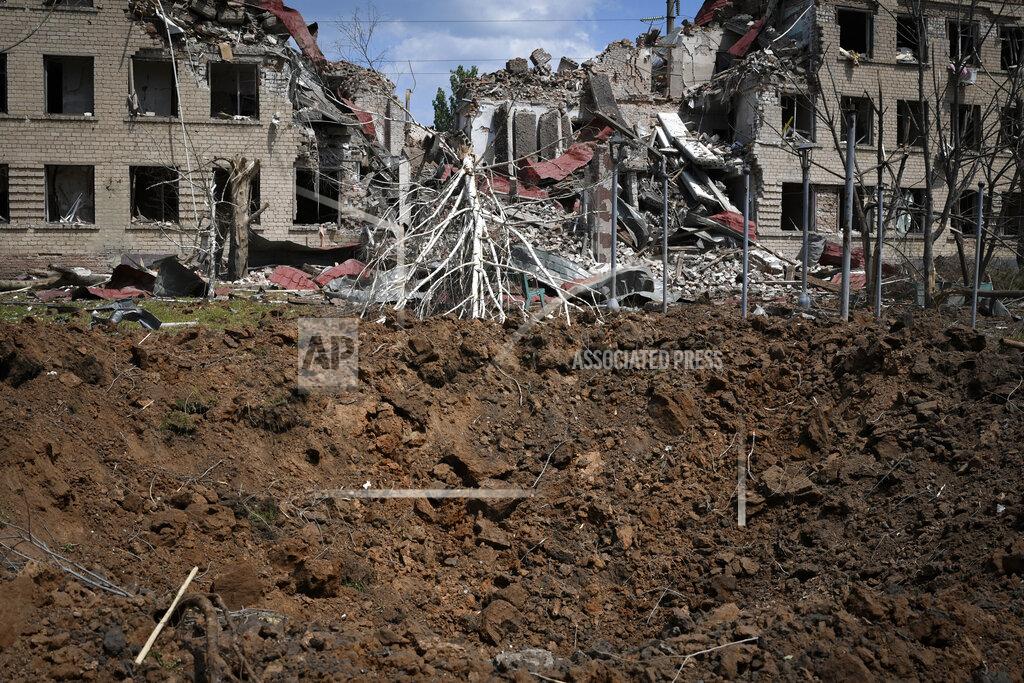 Andriy Andriyenko A crater of an explosion is seen after Russian shelling in Soledar, Donetsk region, Ukraine, Tuesday, May 24, 2022. (AP Photo/Andriy Andriyenko)