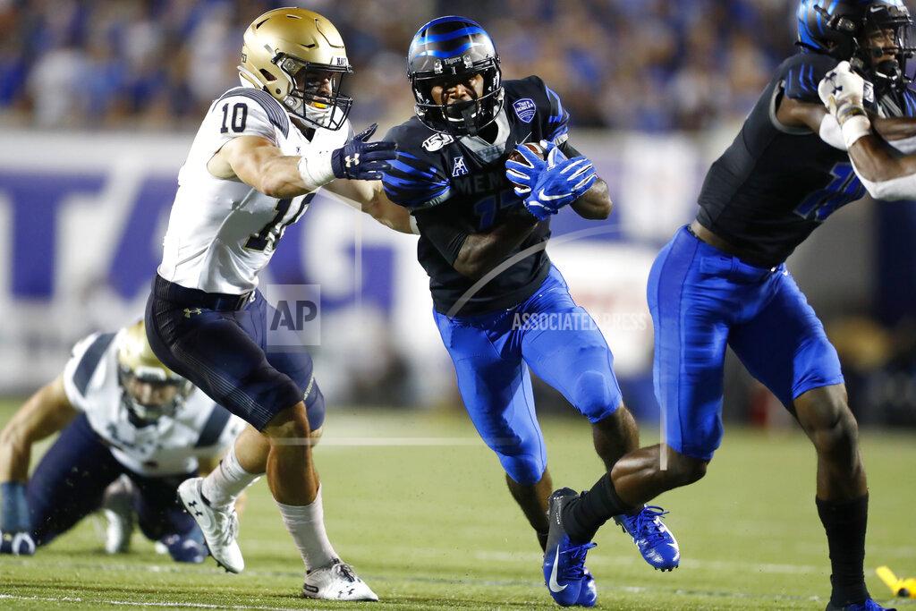 Joe Rondone Memphis running back Kylan Watkins breaks past Navy safety Kevin Brennan during an NCAA college football game in Memphis, Tenn., Thursday, Sept. 26, 2019. (Joe Rondone/The Commercial Appeal via AP)