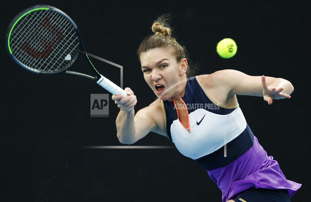 Rick Rycroft Romania's Simona Halep makes a forehand return to Australia's Lizette Cabrera during their first round match at the Australian Open tennis championship in Melbourne, Australia, Monday, Feb. 8, 2021.(AP Photo/Rick Rycroft)