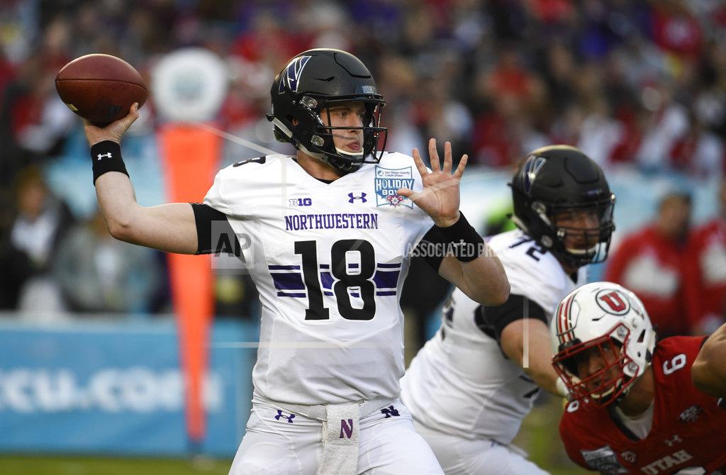 Denis Poroy Northwestern quarterback Clayton Thorson (18) throws under pressure during the first half of the Holiday Bowl NCAA college football game against Utah, Monday, Dec. 31, 2018, in San Diego. (AP Photo/Denis Poroy)