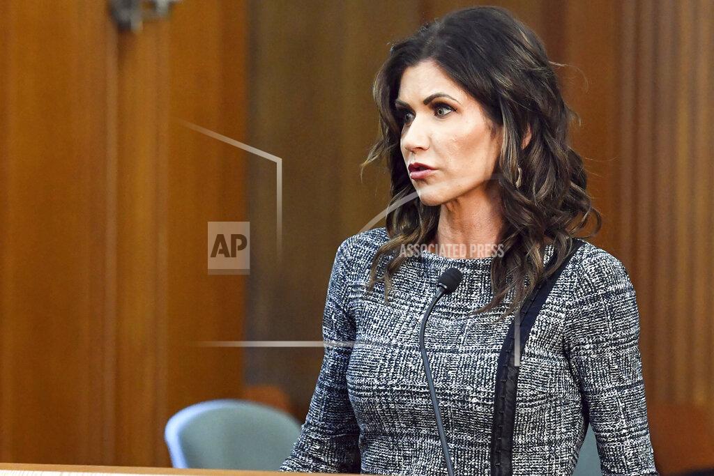 FILE- In this Tuesday, Oct. 13, 2020 file photo, South Dakota Governor Kristi Noem speaks in Sioux Falls, S.D. The largest group representing South Dakota doctors has come out in support of a statewide mask mandate as several cities have moved to require masks in public settings. Gov. Noem has opposed government-imposed mask mandates, arguing they have not been proven to halt the spread of infections. She plans to give an update on the state's coronavirus situation later Wednesday, Nov. 18, 2020. (Erin Bormett/The Argus Leader via AP)