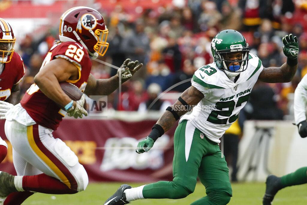 Alex Brandon Washington Redskins running back Derrius Guice (29) runs past New York Jets cornerback Arthur Maulet (23) for a touchdown during the second half of an NFL football game, Sunday, Nov. 17, 2019, in Landover, Md. (AP Photo/Alex Brandon)