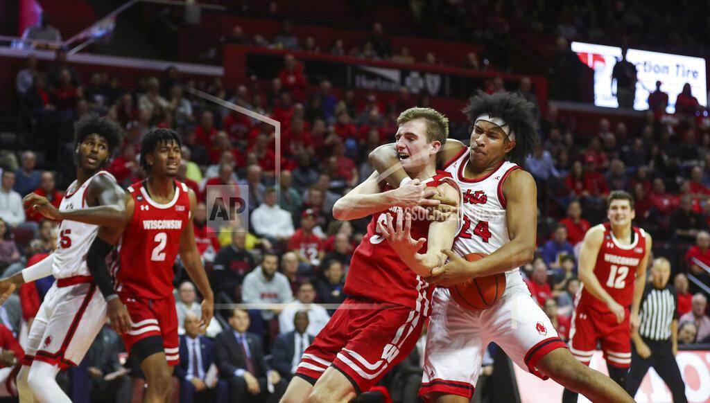 Andrew Mills Rutgers guard Ron Harper Jr. (24) wrestles the ball away from Wisconsin forward Tyler Wahl (5) during the second half of an NCAA college basketball game in Piscataway, N.J., Wednesday, Dec. 11, 2019. (Andrew Mills/NJ Advance Media via AP)