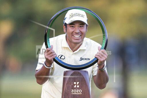 Hideki Matsuyama of Japan poses with the trophy after winning the final round of the Zozo Championship golf tournament at Accordia Golf Narashino Country Club on Sunday, Oct. 24, 2021 in Inzai, Chiba Prefecture, Japan. (AP Photo/Tomohiro Ohsumi)