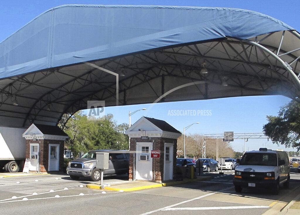 Melissa Nelson FILE- In this Jan. 29, 2016 file photo shows the entrance to the Naval Air Base Station in Pensacola, Fla. The FBI has found a link between the gunman in a deadly attack at a military base last December and an al-Qaida operative. That's according to a U.S. official who spoke to The Associated Press on Monday. (AP Photo/Melissa Nelson, File)