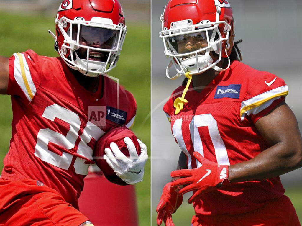 Uncredited FILE - At left, Kansas City Chiefs running back Clyde Edwards-Helaire runs a drill during the NFL football team's organized team activities Thursday, June 2, 2022, in Kansas City, Mo. At right, Chiefs running back Isiah Pacheco is shown during drills at the NFL football team's mandatory minicamp Tuesday, June 14, 2022, in Kansas City, Mo. A third of the way through training camp, the two are in a heated race to be the starting running back of the Chiefs. (AP Photo/File)