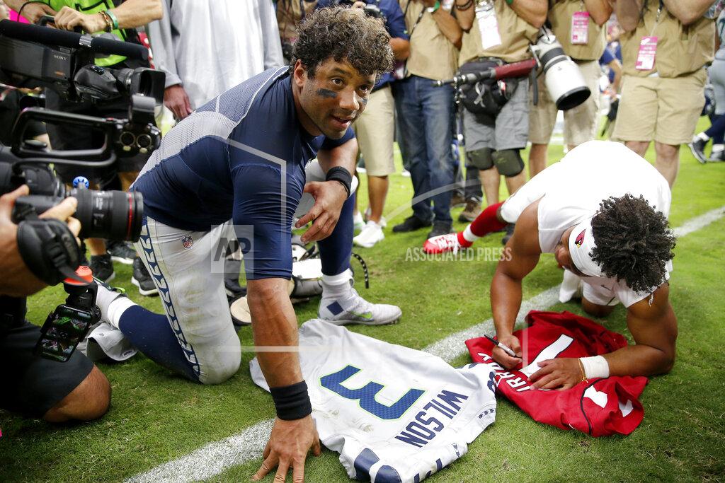 Rick Scuteri Seattle Seahawks quarterback Russell Wilson, left, and Arizona Cardinals quarterback Kyler Murray, left, exchange jerseys after an NFL football game, Sunday, Sept. 29, 2019, in Glendale, Ariz. (AP Photo/Rick Scuteri)