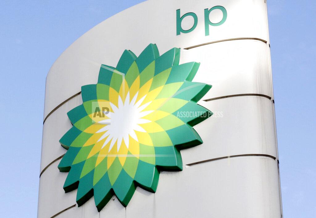 FILE - This Tuesday, Aug. 1, 2017 file photo shows the BP logo at a petrol station in London. Energy company BP is writing off as much as $17.5 billion from its oil and gas assets and will review its plans to develop oil wells as the COVID-19 pandemic accelerates its goal of decreasing its reliance on fossil fuels. (AP Photo/Caroline Spiezio, File)
