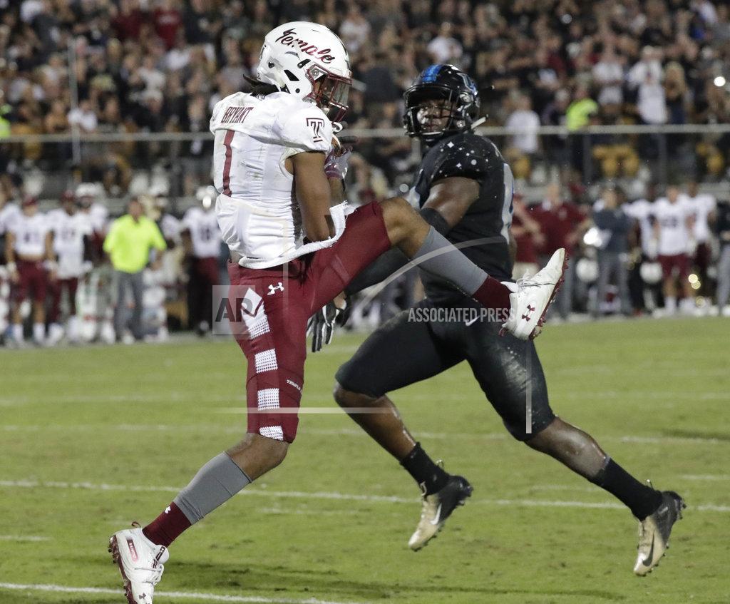 John Raoux Temple wide receiver Ventell Bryant (1) catches a 15-yard touchdown pass in front of Central Florida linebacker Eric Mitchell during the first half of an NCAA college football game Thursday, Nov. 1, 2018, in Orlando, Fla. (AP Photo/John Raoux)