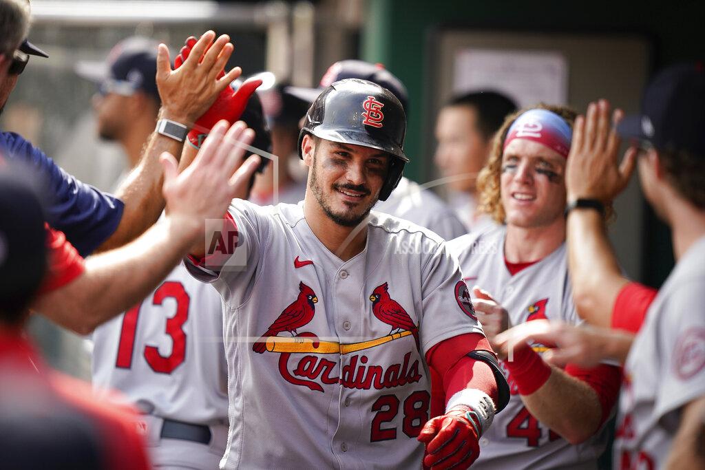 Bryan Woolston St. Louis Cardinals' third baseman Nolan Arenado (28) celebrates with teammates after hitting a home run during the ninth inning of a baseball game against the Cincinnati Reds in Cincinnati, Sunday, July 25, 2021. (AP Photo/Bryan Woolston)