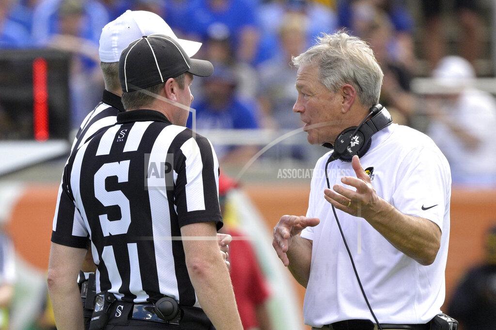 Phelan M. Ebenhack Iowa head coach Kirk Ferentz, right, talks to officials after a play during the first half of the Citrus Bowl NCAA college football game against Kentucky, Saturday, Jan. 1, 2022, in Orlando, Fla. (AP Photo/Phelan M. Ebenhack)
