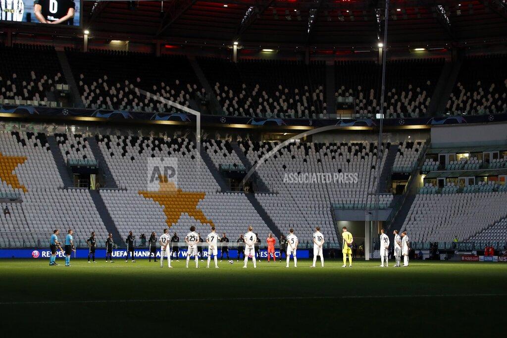 Antonio Calanni Players observe a moment of silence in memory of all victims of COVID-19 pandemic ahead of the Champions League round of 16, second leg, soccer match between Juventus and Lyon at the Allianz stadium in Turin, Italy, Friday, Aug. 7, 2020. (AP Photo/Antonio Calanni)