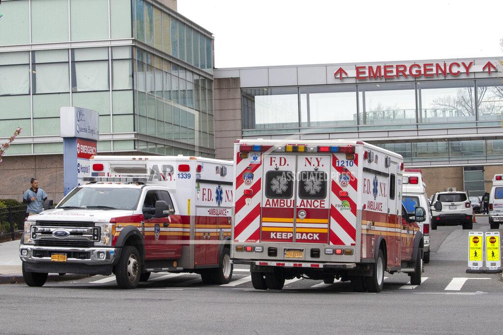 Mary Altaffer FDNY ambulances are seen entering and leaving the emergency room at Queens Hospital Center, Monday, April 20, 2020, in the Jamaica neighborhood of the Queens borough of New York. The new coronavirus causes mild or moderate symptoms for most people, but for some, especially older adults and people with existing health problems, it can cause more severe illness or death. (AP Photo/Mary Altaffer)