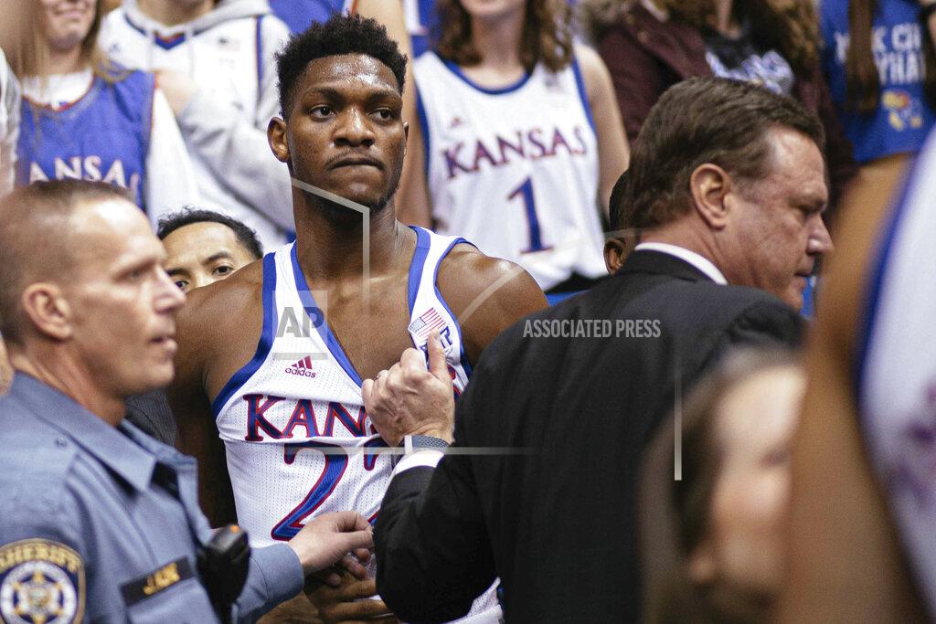 Emma Pravecek Kansas forward Silvio De Sousa (22) and coach Bill Self stand on court side following a brawl in the second half of an NCAA college basketball game against Kansas State, Jan. 21, 2020 in Lawrence, Kan. (Emma Pravecek/University Daily Kansan via AP)
