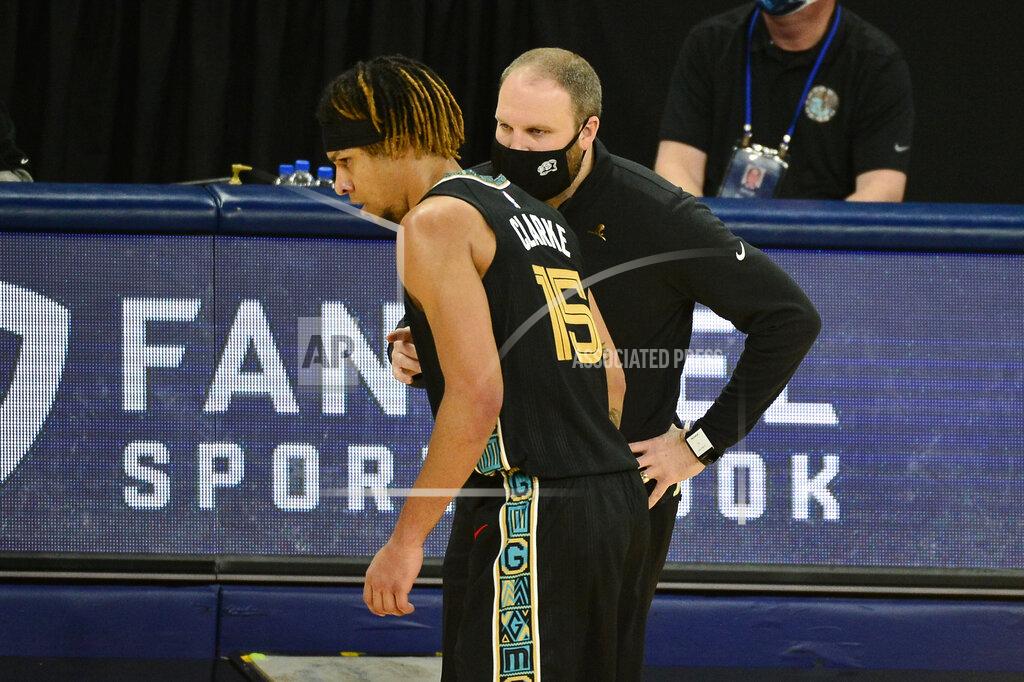 Brandon Dill Memphis Grizzlies head coach Taylor Jenkins, front right, talks with forward Brandon Clarke (15) in the first half of an NBA basketball game against the Phoenix Suns, Monday, Jan. 18, 2021, in Memphis, Tenn. (AP Photo/Brandon Dill)